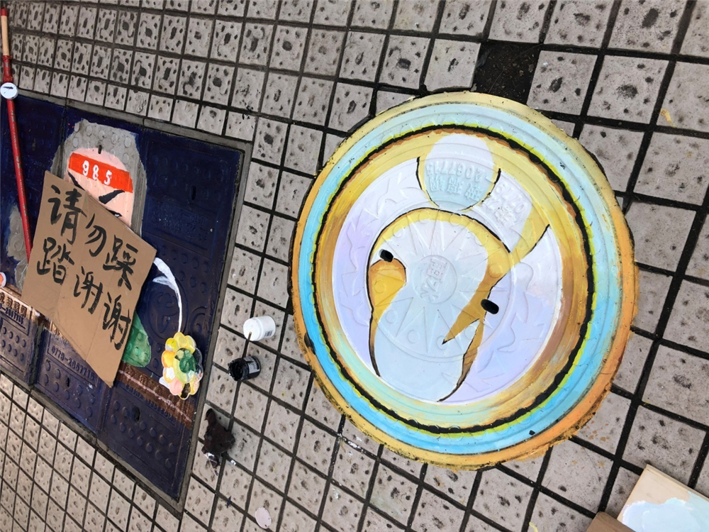 笔墨丹青迎华诞,旧井新颜贺良辰——钦州二中第一届井盖创意绘画比赛成功举办